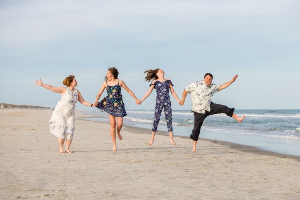 family photo charleston the whole family is jumping on the beach