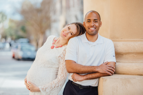 family photo charleston pregnant woman with her husband in downtown