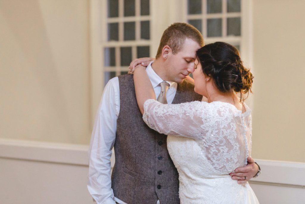 bride and groom hugging