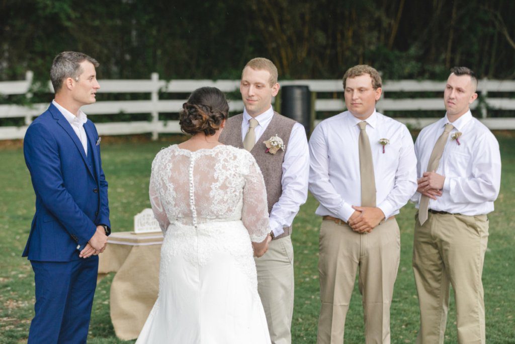 bride and groom holding their hands