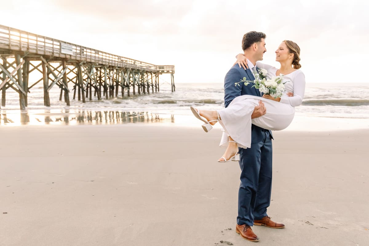 holding hands isle of palms pier elopement