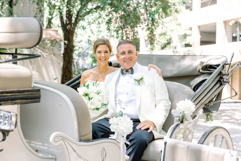couple in a carriage Charleston elopement photography