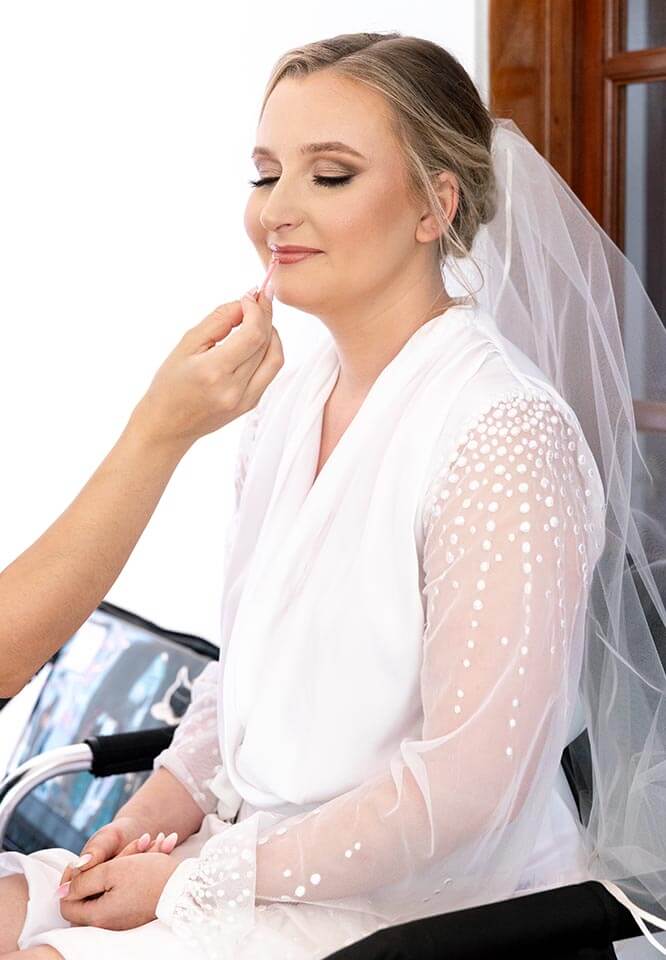The Bride is doing Makeup in Preparation for Elopement Ceremony