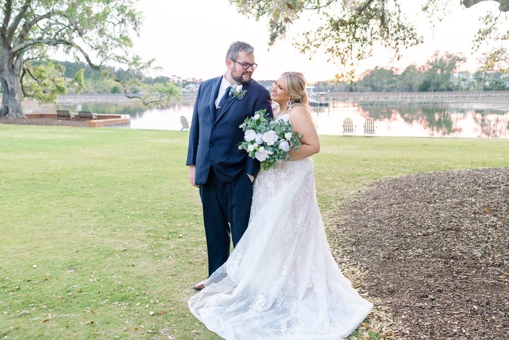 bride and groom by water dunes west