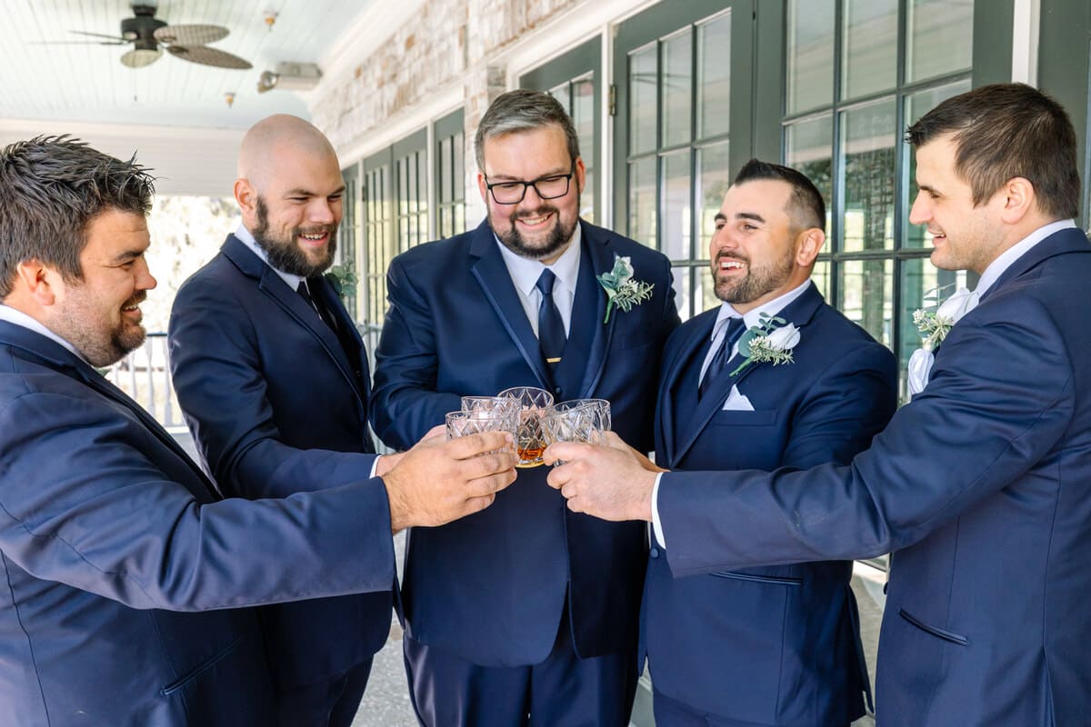 groomsmen laughing dunes west charleston