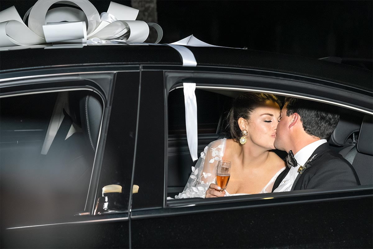 Charleston Wedding Photographer Newlyweds leaving by car