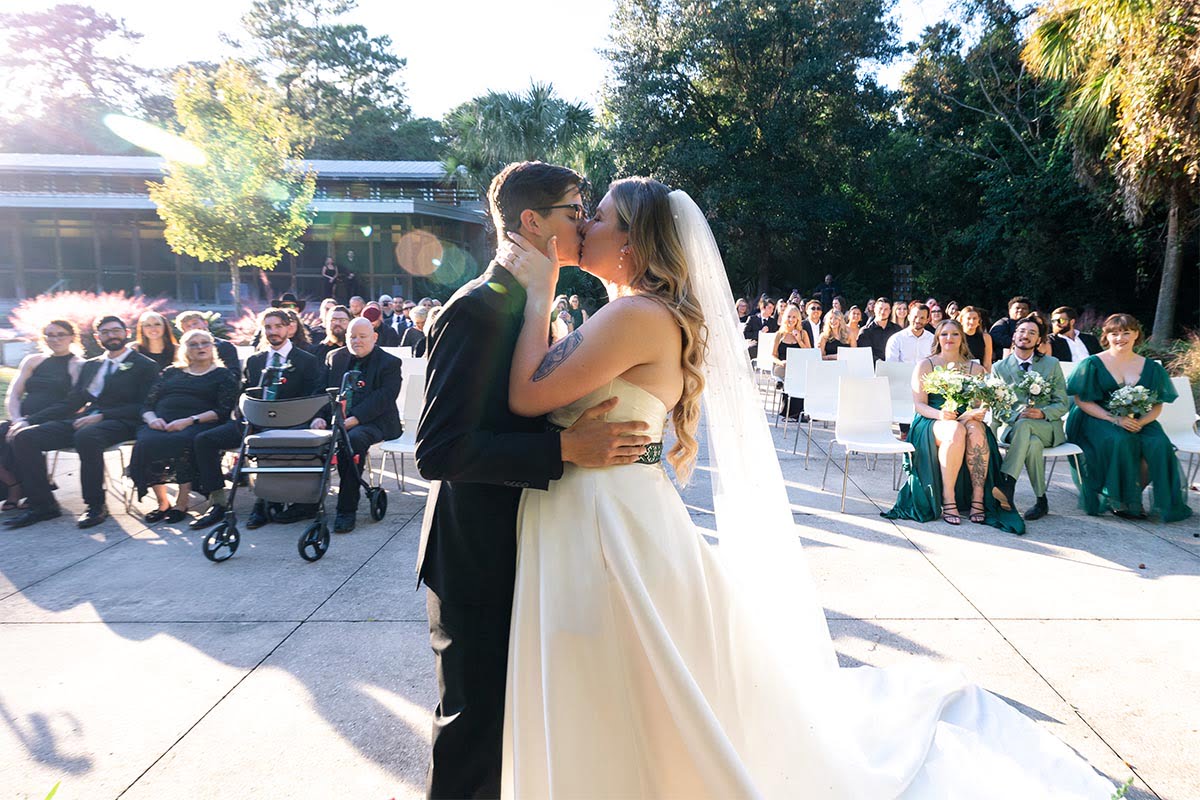 Charleston Wedding Photographer First kiss from side of bride and groom