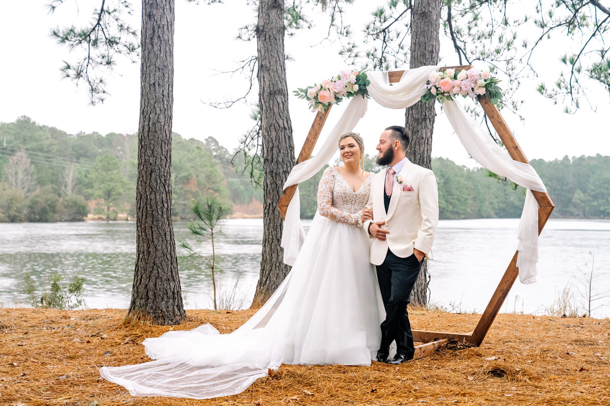 the Lake House at Bulow wedding venue couple by the arch