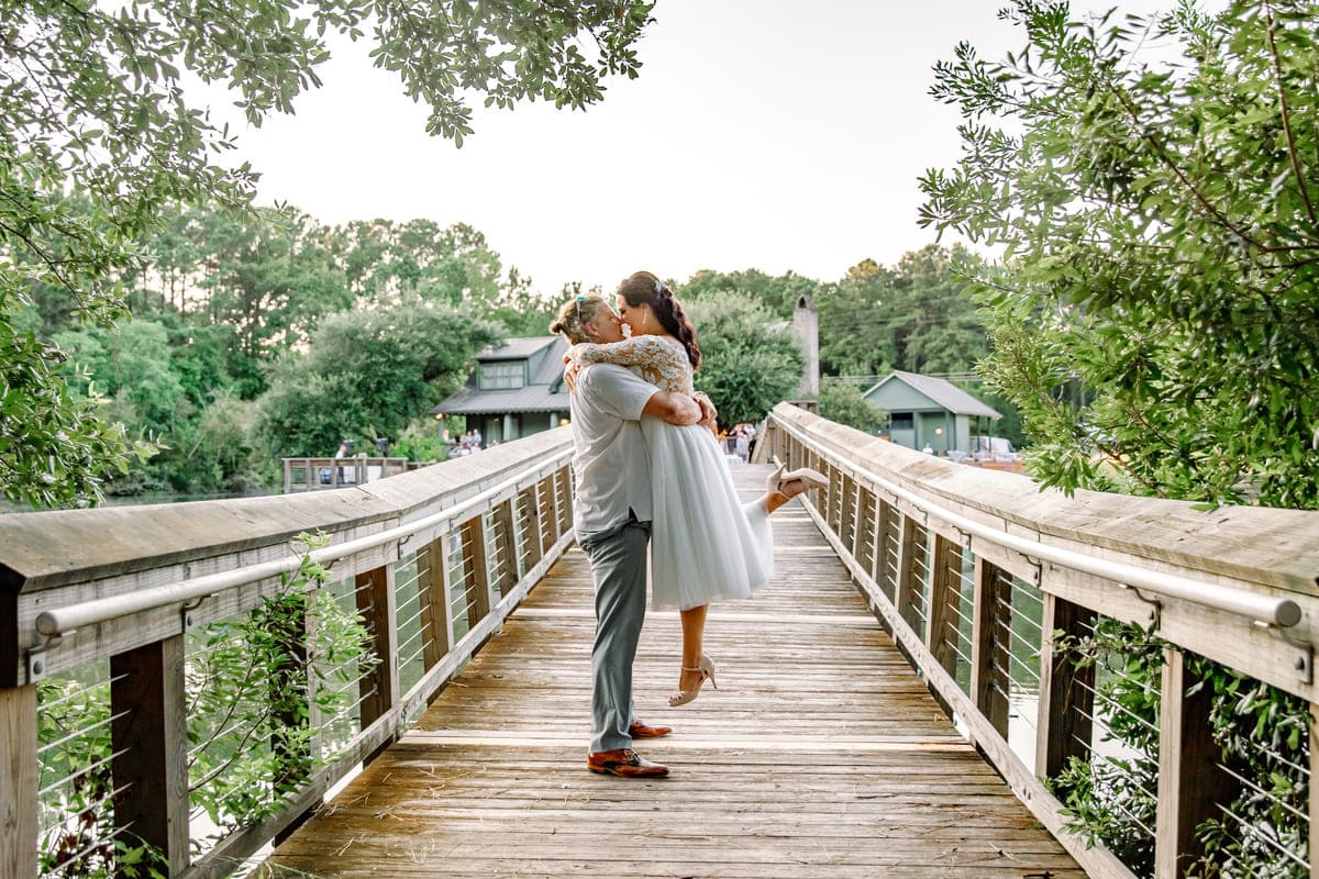 the Lake House at Bulow wedding venue couple on a bridge