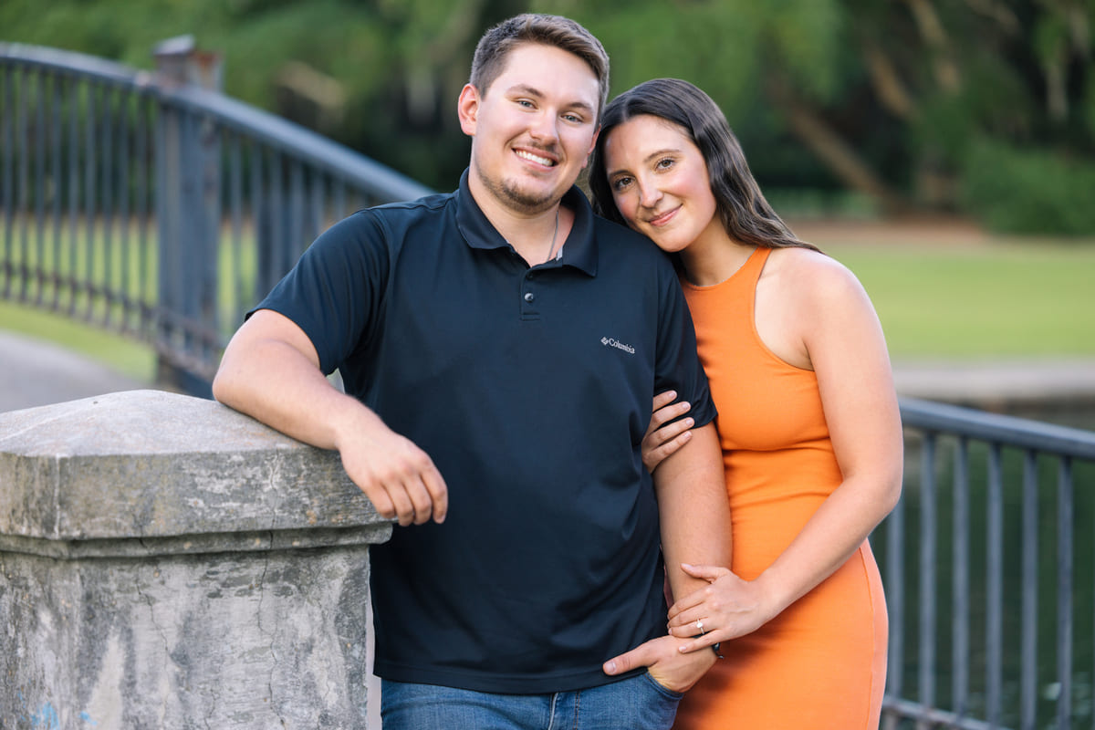 hampton park proposal couple near the bridge