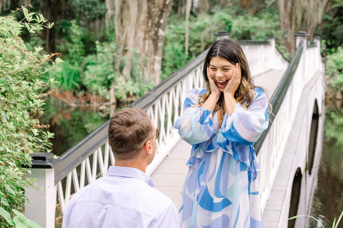 joyful proposal near magnolia gardens bridge