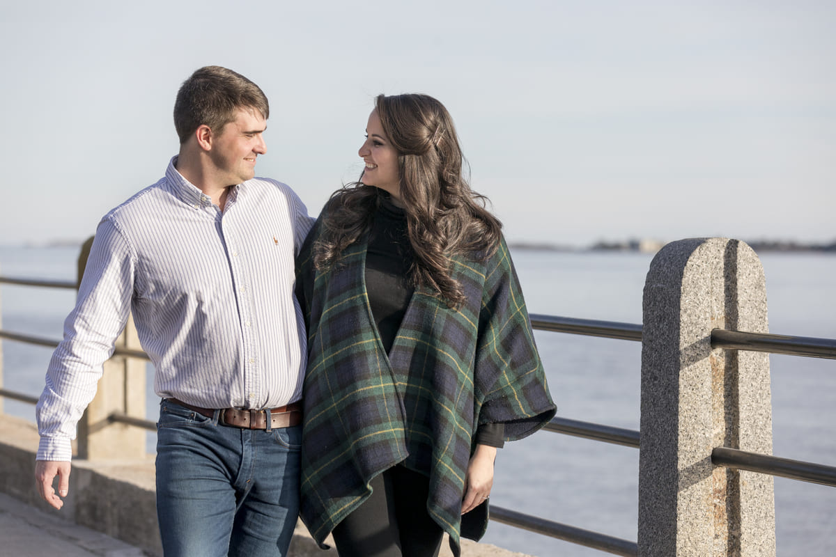 walking couple after proposal at white point garden