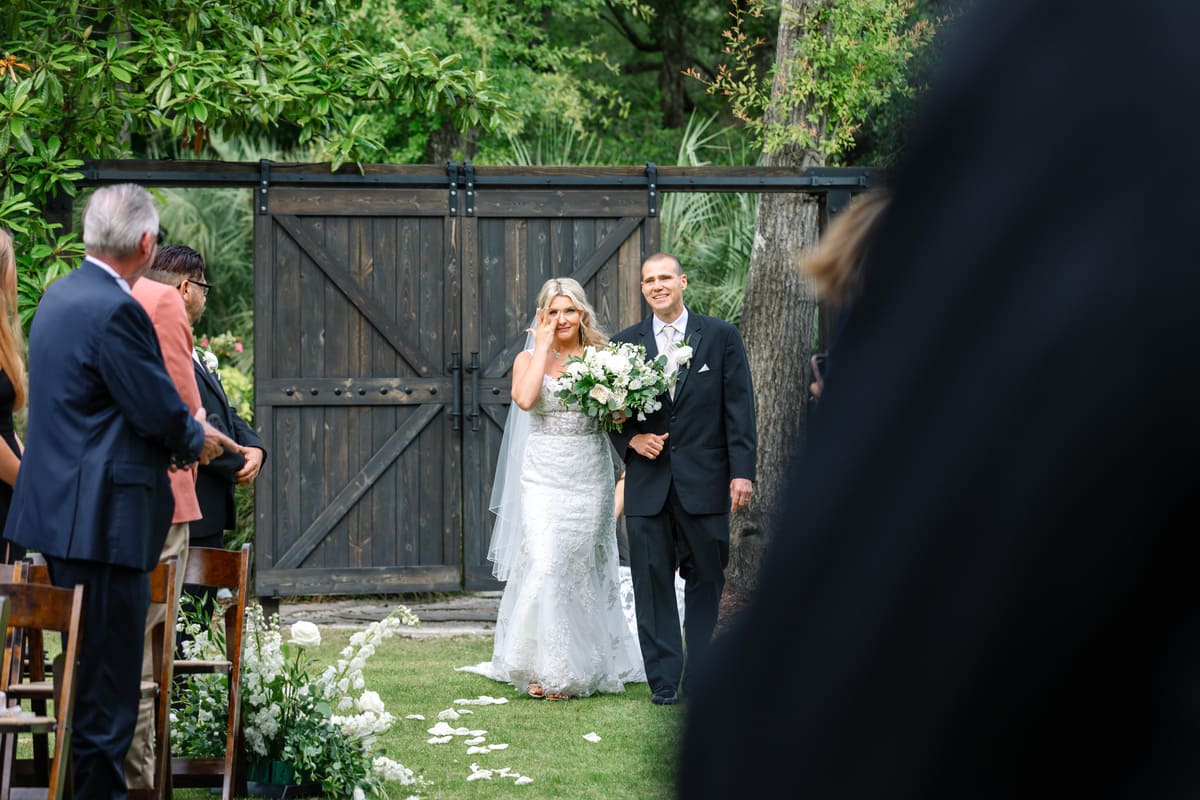 bride walking aisle dad hart meadows ranch