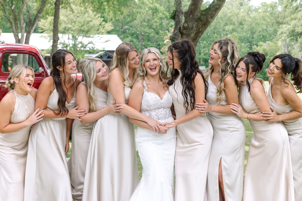 bridesmaids hugging bride charleston wedding