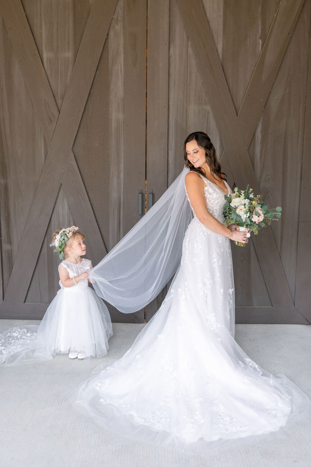 bride and flower girl by charleston wedding photographers