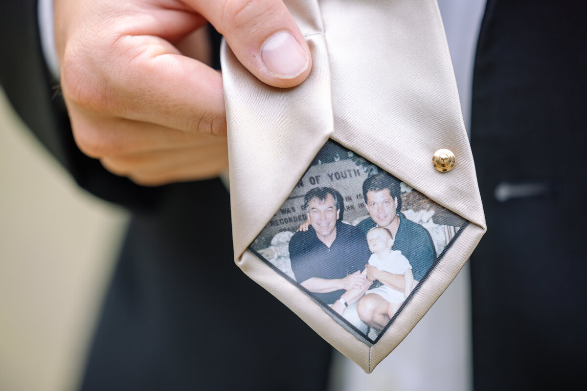 groom adjusting tie charleston wedding