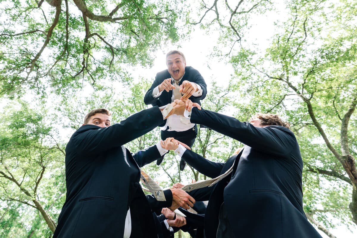 groom joking with groomsmen hart meadows