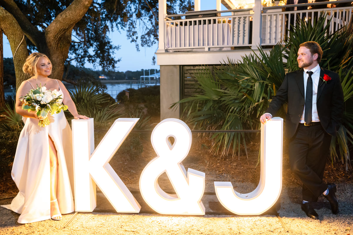 sunset photos marquee letters charleston wedding