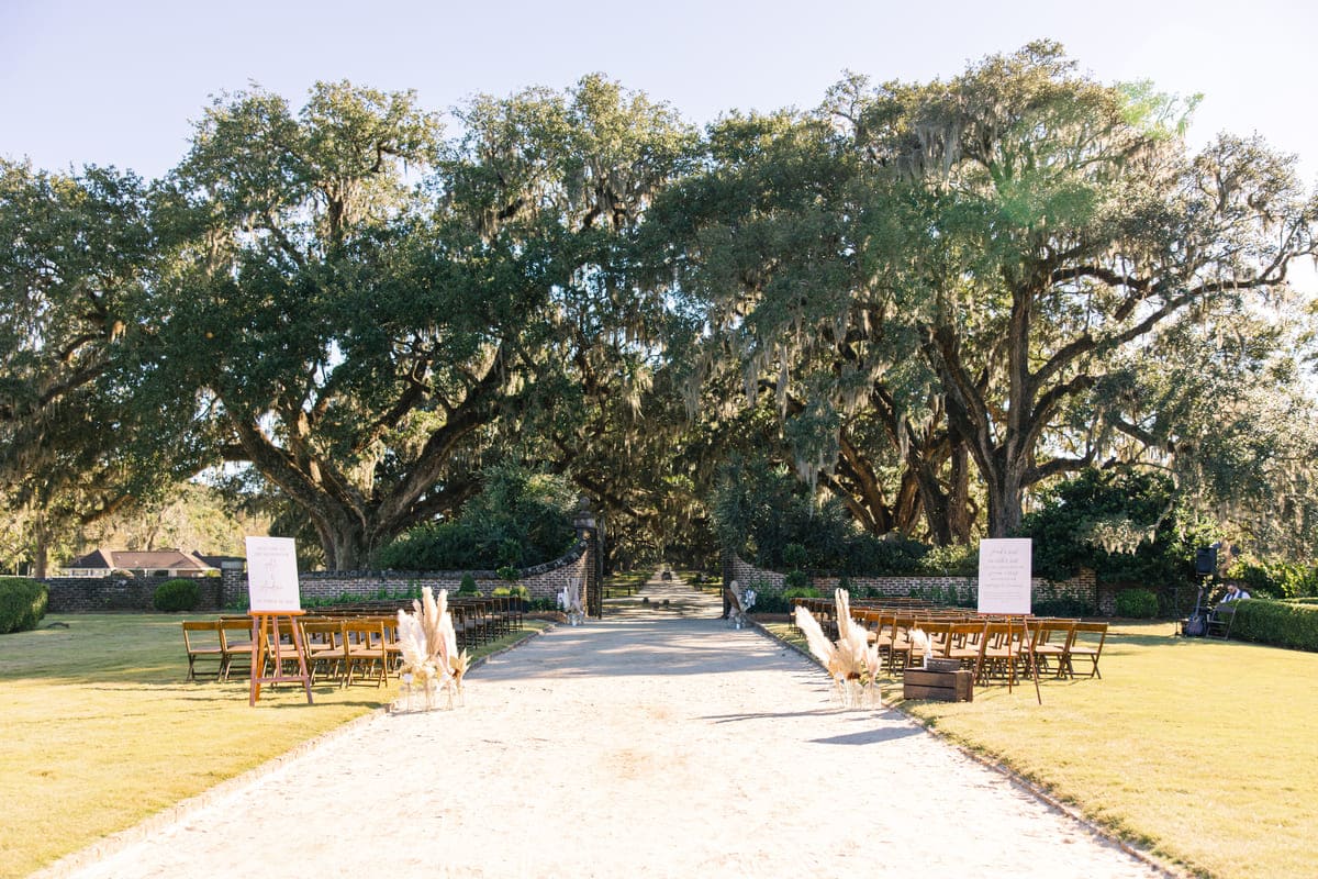 bride walking down aisle boone hall charleston wedding