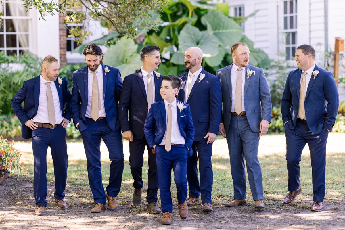 couple walking under oaks wedding boone hall charleston photographer