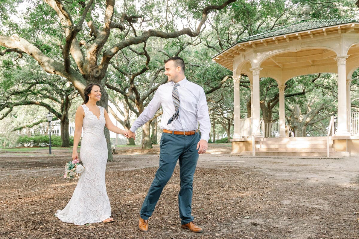 bride and groom walking white point garden