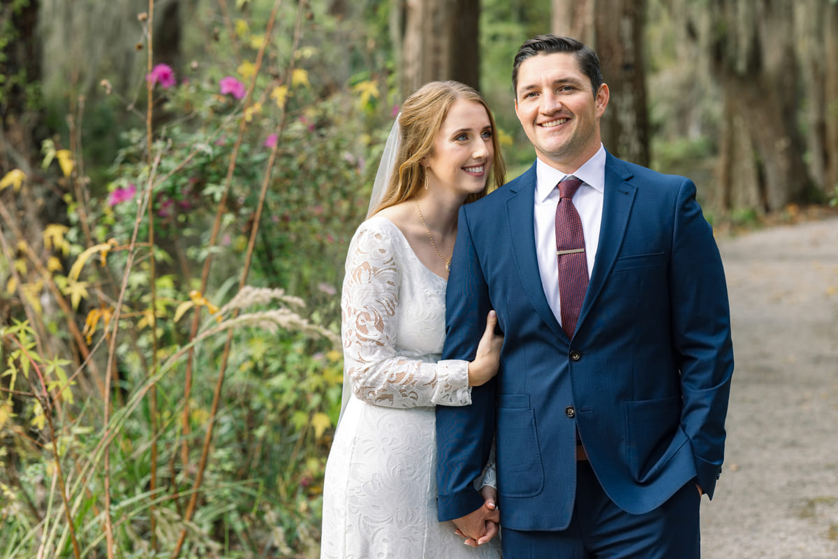 couple walking in garden charleston elopement