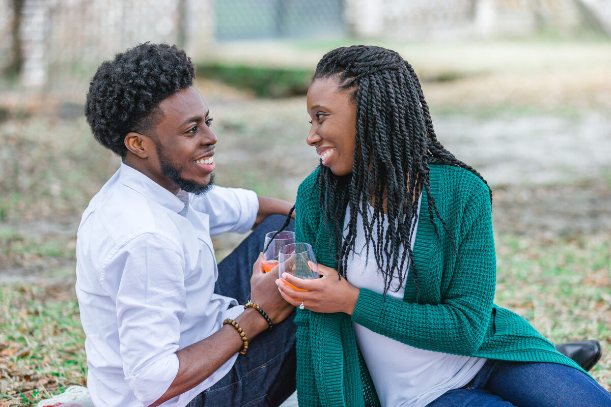 couple with picnic drinks middleton place proposal