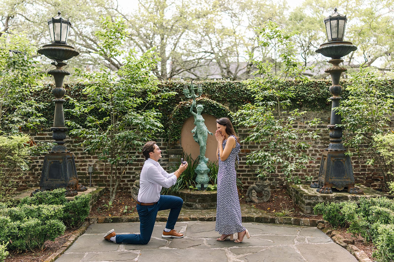 Woman surprised during the secret proposal moment at 20th South Battery