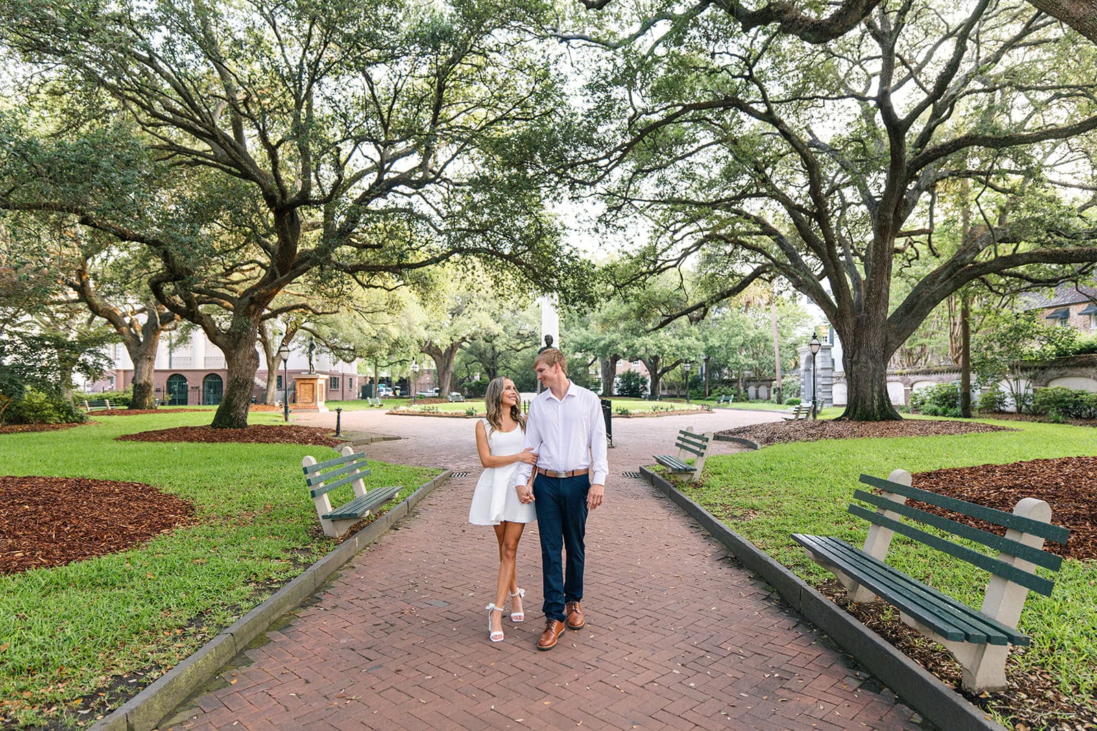 Couple walking at Washington Square after a surprise proposal