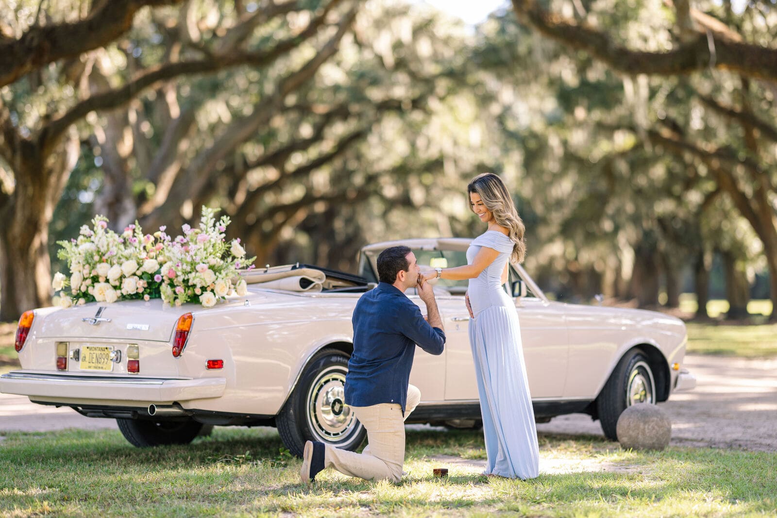 Secret proposal with decorated retro car in Charleston park